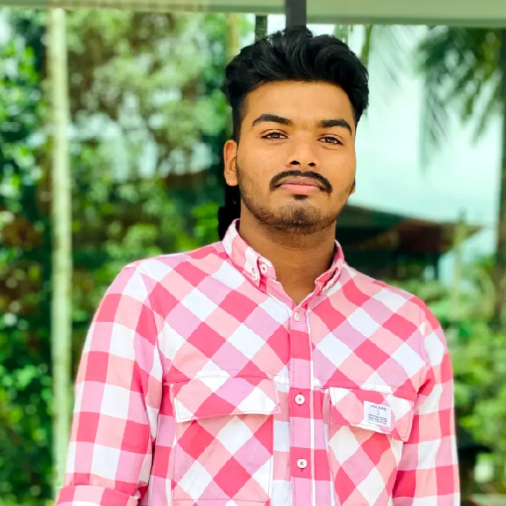 Shahal, Digital Marketer, sharing a testimonial about Jishad Muhammed's branding and graphic design services.